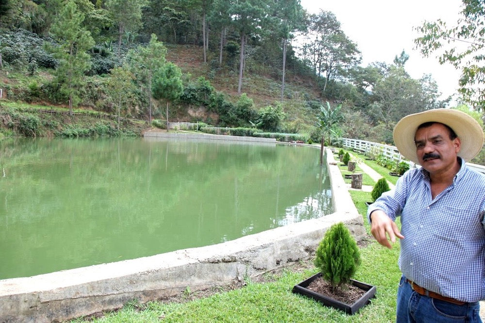 Guadalupe 'Beto' Reyes next to the water pond at El Limon in Palencia, Guatemala